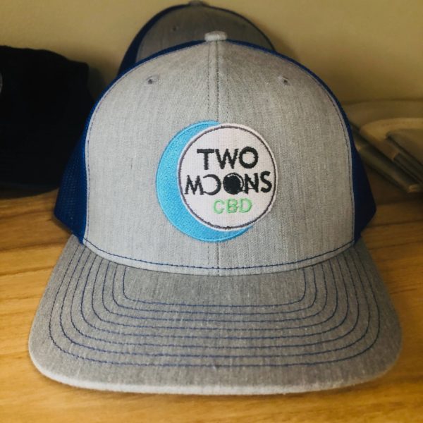 two moons cbd tan and blue hat with logo